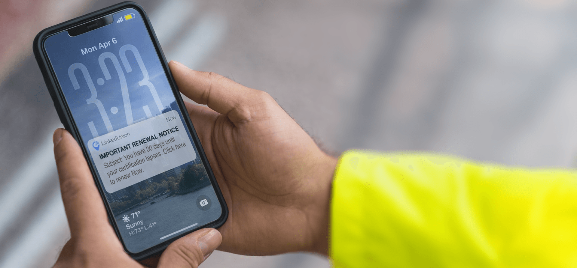 Hands holding a phone showing a push notification
