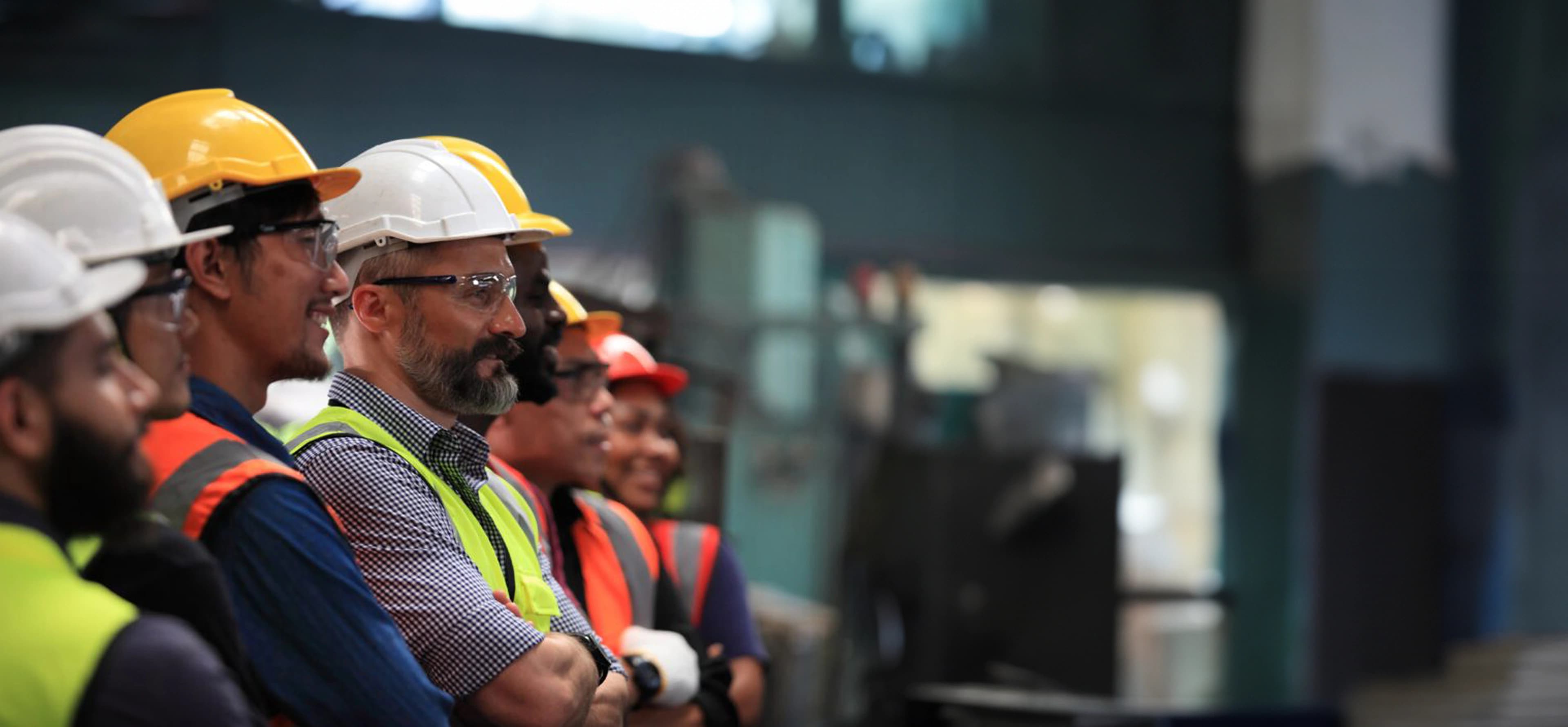 Group of union workers smiling on a job site